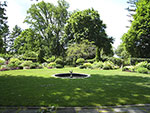 view across lawn from new stone terrace at house